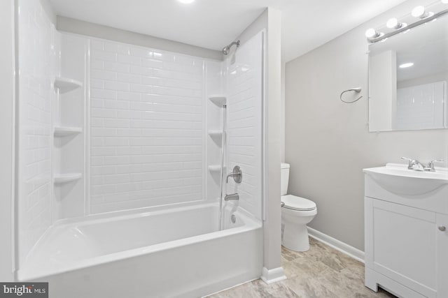 bathroom with baseboards, toilet, vanity, and bathtub / shower combination