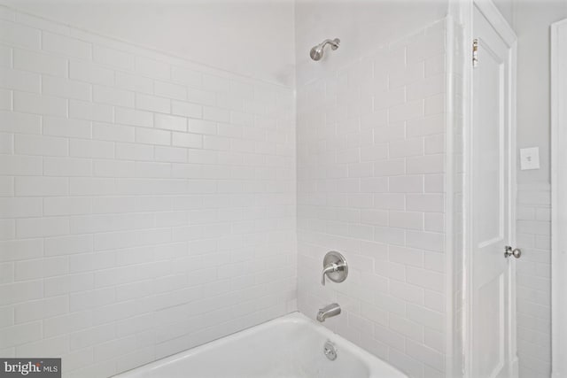 full bathroom with washtub / shower combination