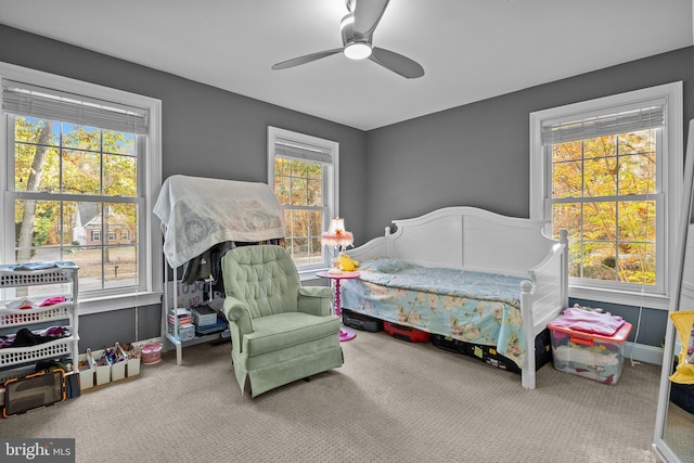 carpeted bedroom featuring ceiling fan