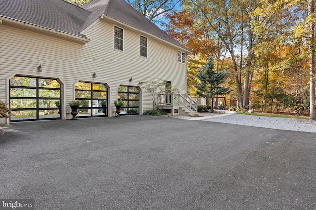 view of side of property featuring a shingled roof