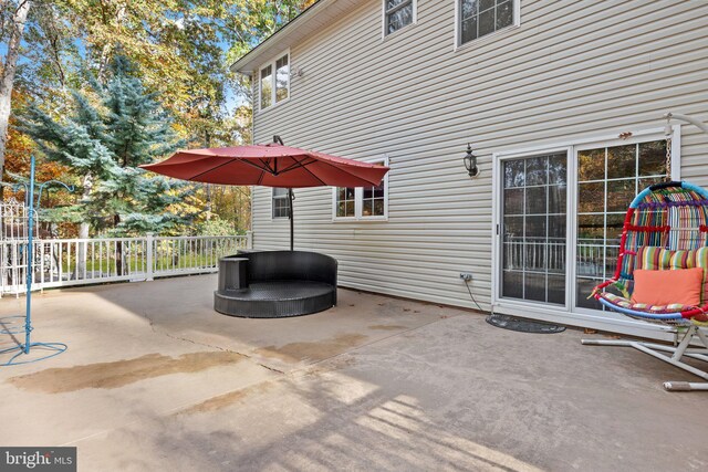 view of patio featuring fence