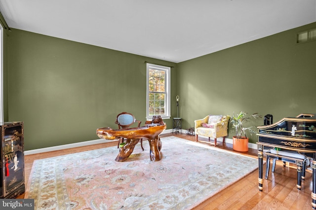 office with wood finished floors and baseboards