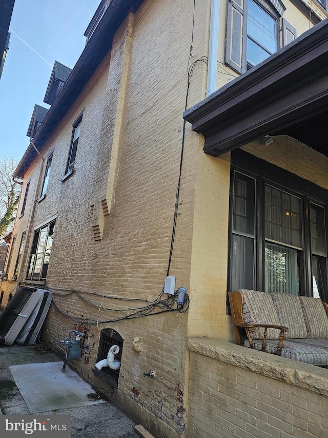 view of side of home featuring brick siding