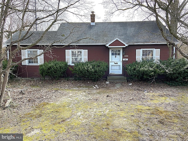 view of front of property with a chimney and entry steps