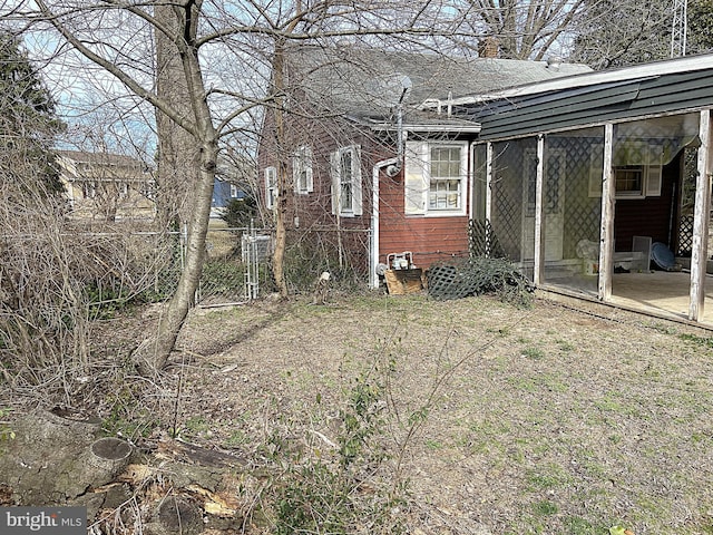 exterior space with fence and a chimney