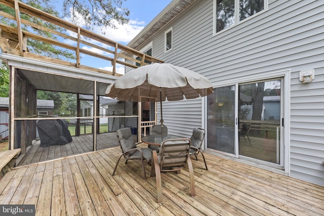 deck featuring outdoor dining area