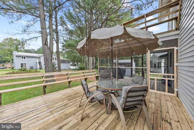 wooden terrace featuring outdoor dining space