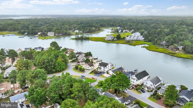 drone / aerial view featuring a residential view and a water view