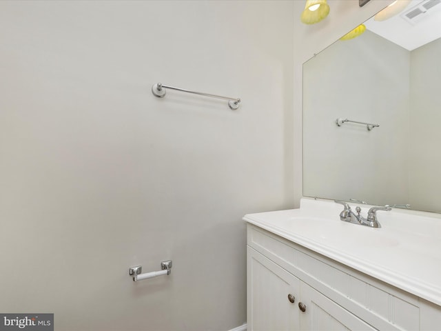 bathroom with visible vents and vanity