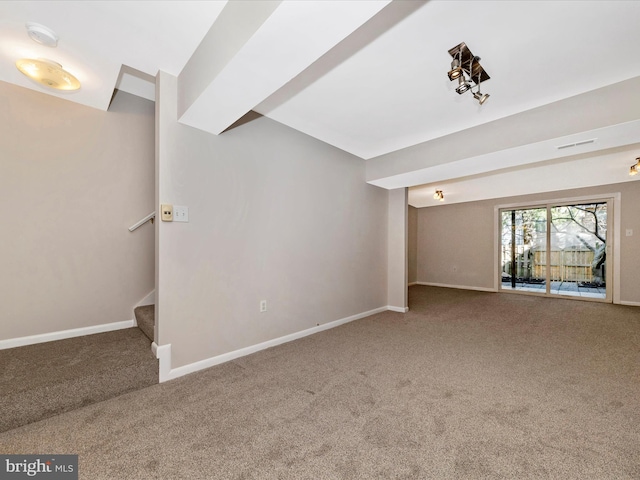 interior space with stairs, visible vents, carpet, and baseboards