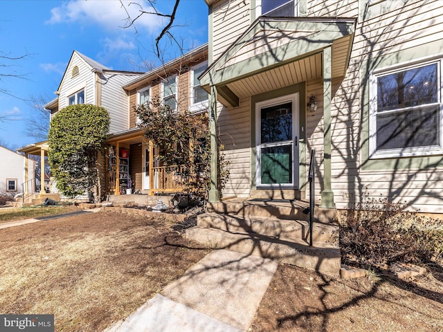 doorway to property featuring covered porch