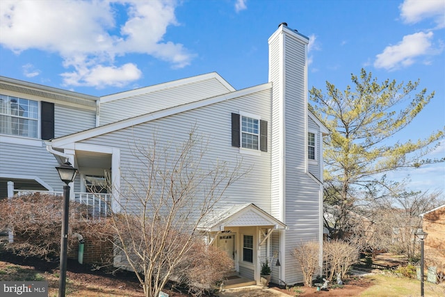 view of home's exterior featuring a chimney