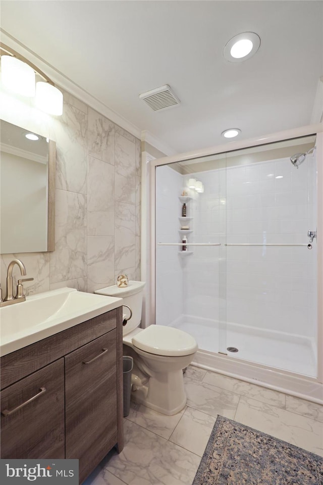 full bath featuring vanity, visible vents, marble finish floor, and a stall shower