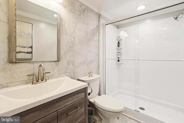 bathroom featuring a shower stall, toilet, and crown molding