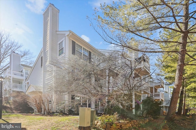 view of property exterior featuring a chimney