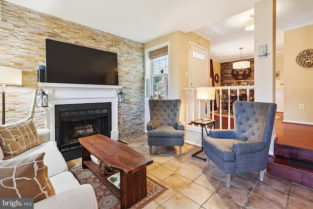 tiled living room with a fireplace and baseboards