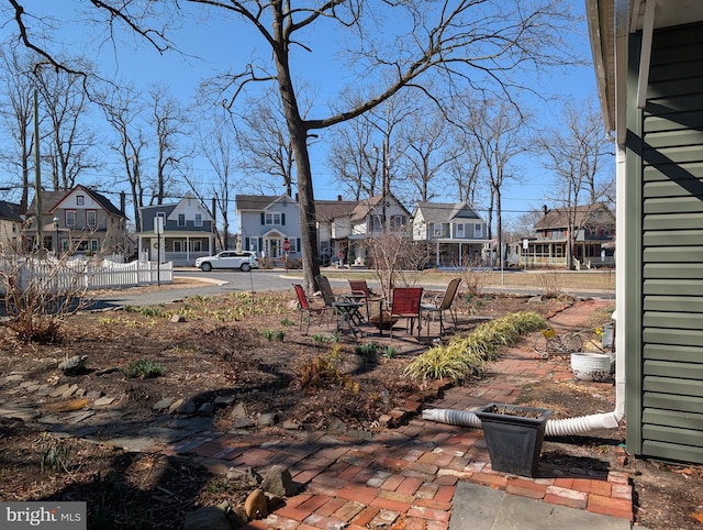 view of yard featuring a residential view and fence