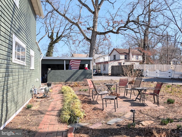 view of yard with a patio and fence