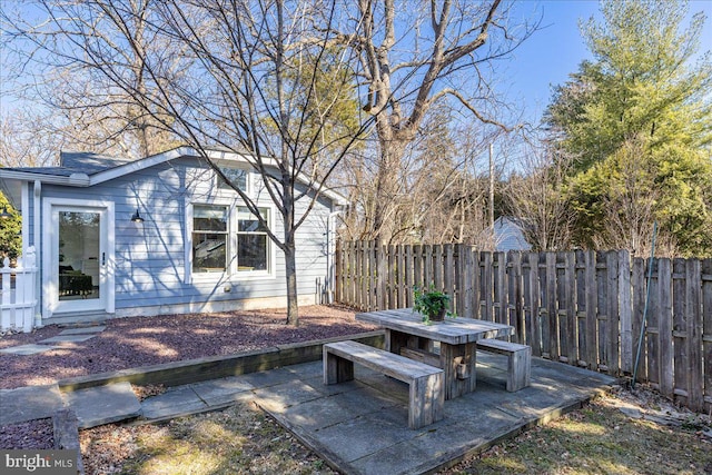 view of patio featuring fence