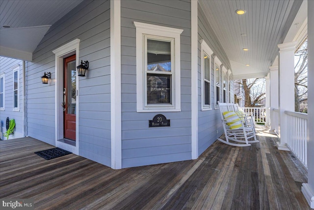 wooden terrace with a porch