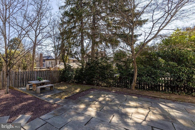 view of patio featuring fence