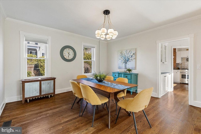 dining space featuring a chandelier, visible vents, dark wood finished floors, and baseboards