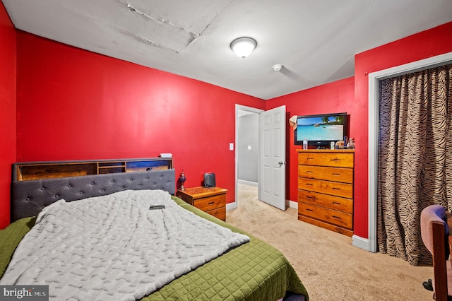 bedroom featuring carpet flooring and baseboards