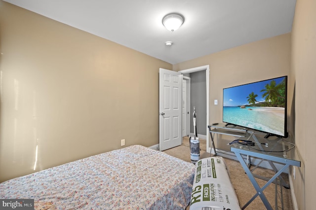 bedroom with carpet flooring and baseboards