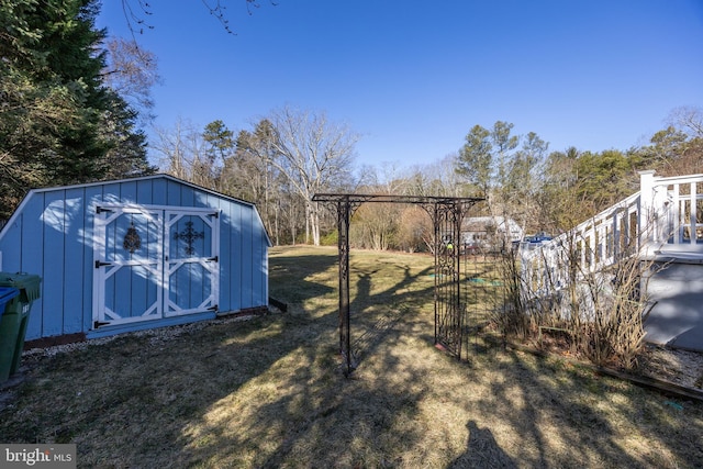 view of yard with an outbuilding and a storage shed