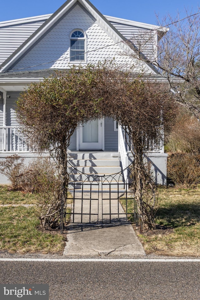 view of property exterior with a gate