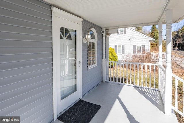 property entrance featuring covered porch