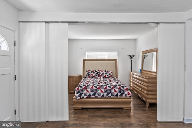 bedroom with wood finished floors