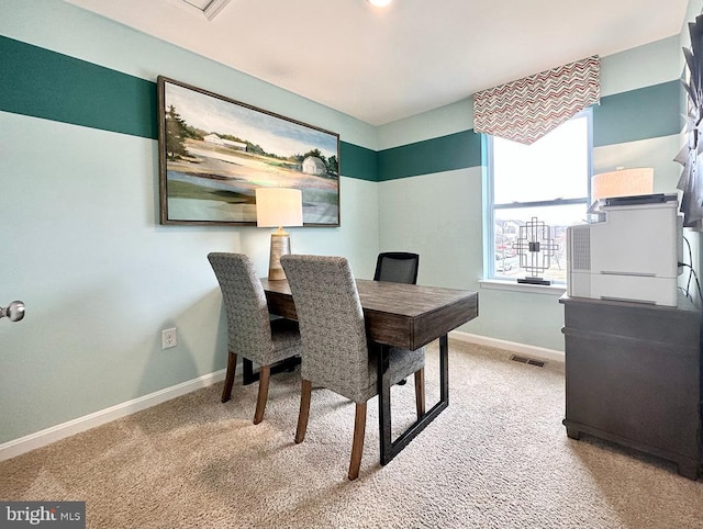 dining space featuring visible vents, baseboards, and carpet flooring