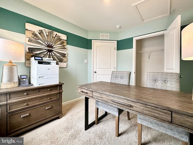 home office featuring visible vents, light colored carpet, attic access, and baseboards