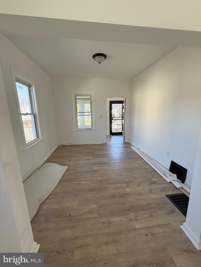 239 Midland, Brooklyn, MD 21225 - empty room featuring visible vents and wood finished floors