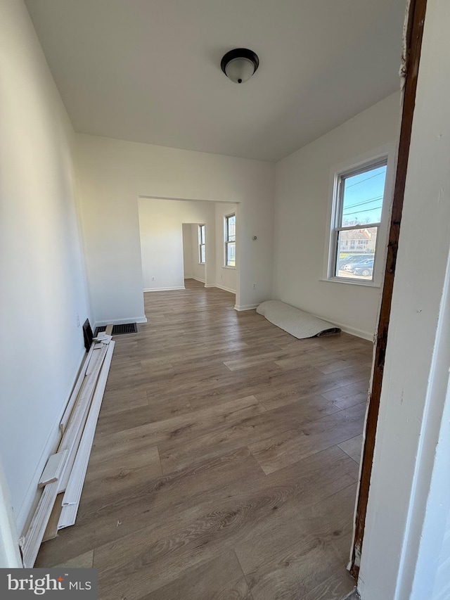 239 Midland, Brooklyn, MD 21225 - unfurnished room featuring baseboards and wood finished floors