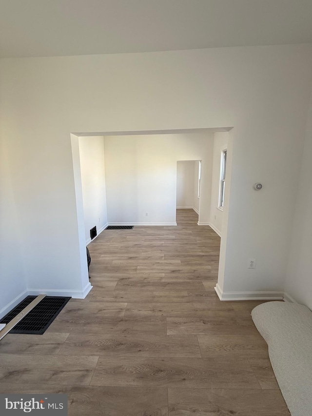 239 Midland, Brooklyn, MD 21225 - interior space featuring baseboards, visible vents, and wood finished floors