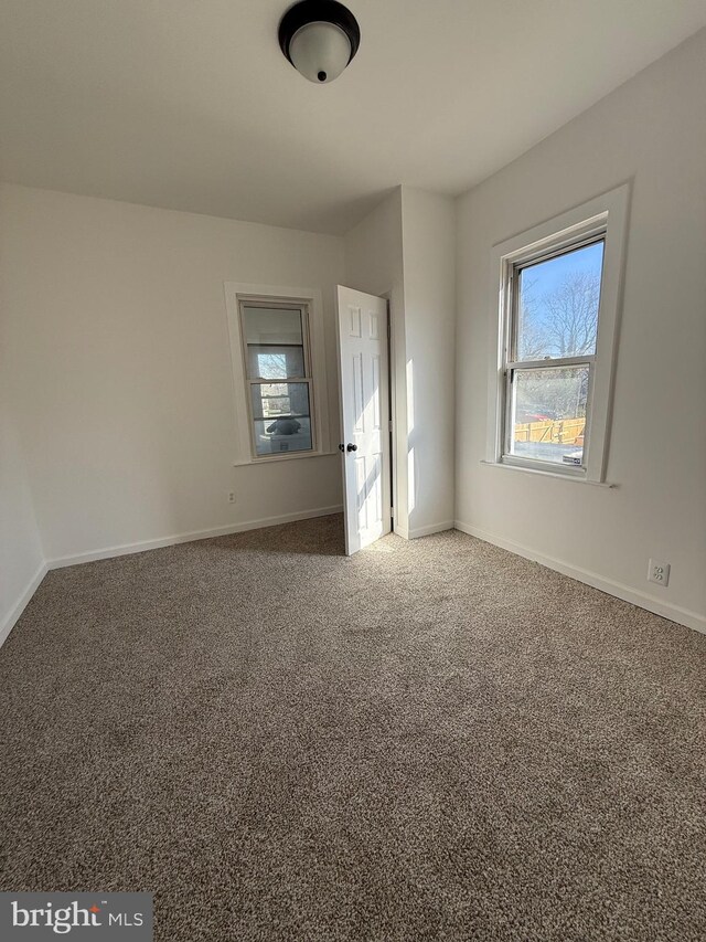 239 Midland, Brooklyn, MD 21225 - unfurnished room featuring carpet and baseboards