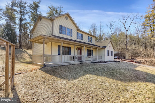 farmhouse inspired home with covered porch and driveway