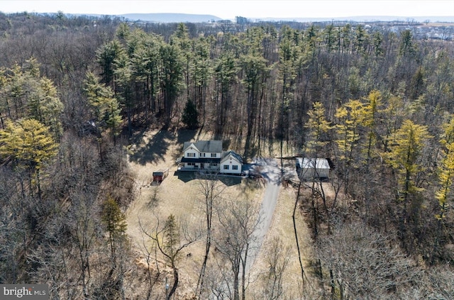 aerial view with a wooded view