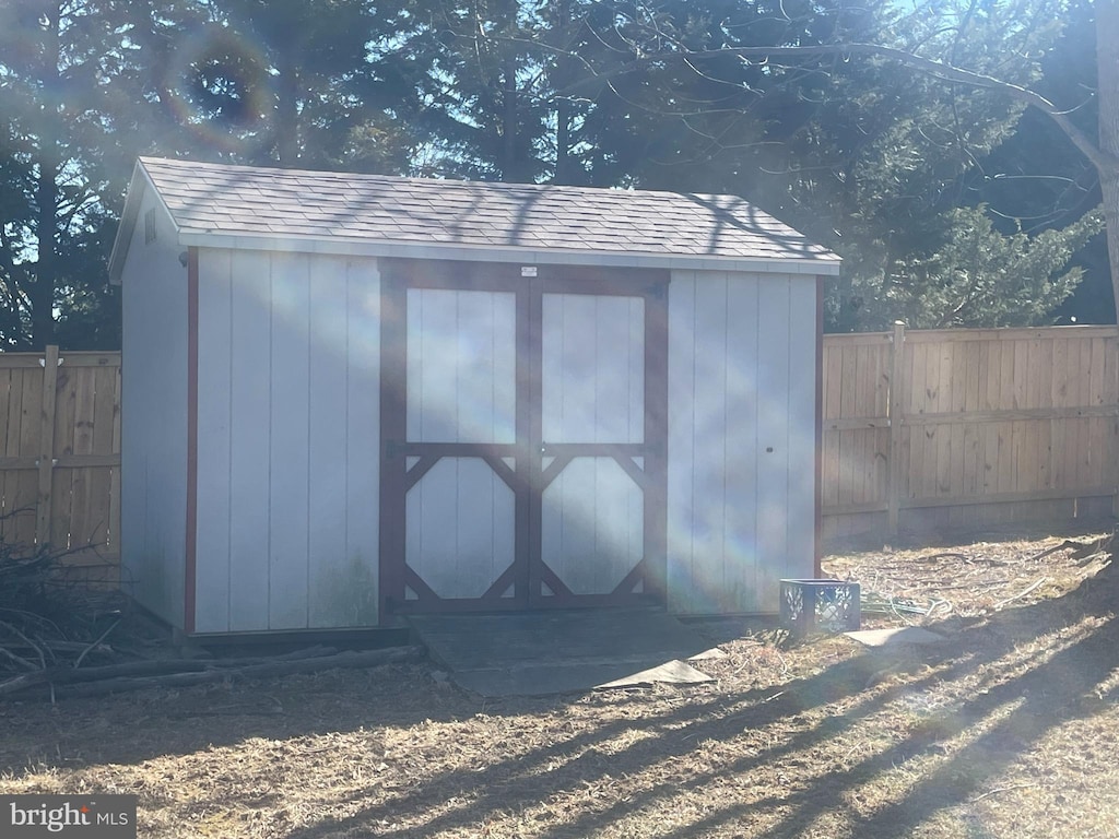 view of shed with a fenced backyard