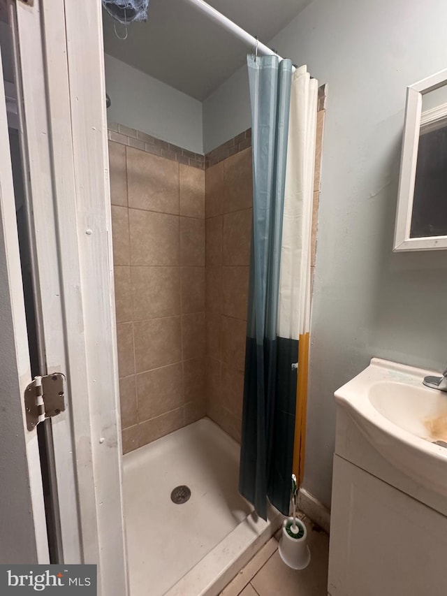 bathroom featuring vanity and a stall shower