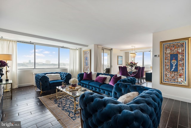 living area featuring baseboards and wood tiled floor