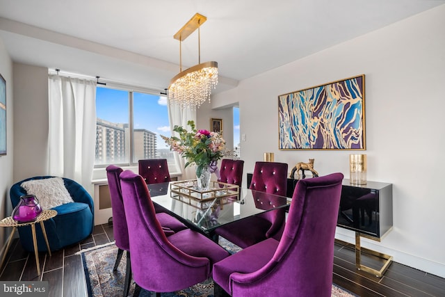 dining room featuring a notable chandelier and wood tiled floor