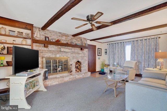 living area featuring carpet flooring, beam ceiling, ceiling fan, and a fireplace