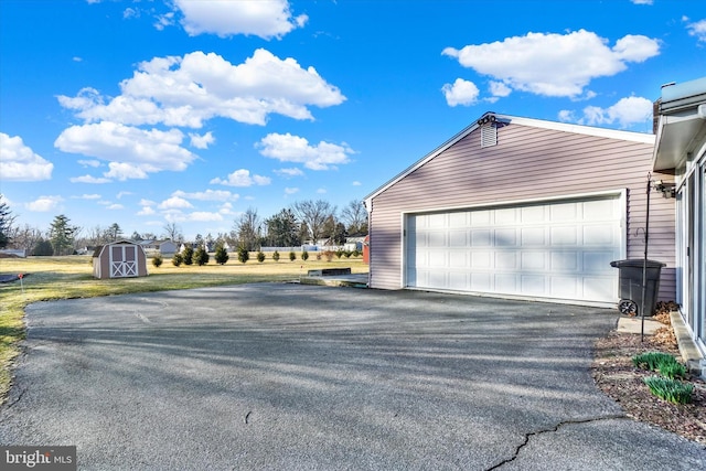 garage featuring a storage shed