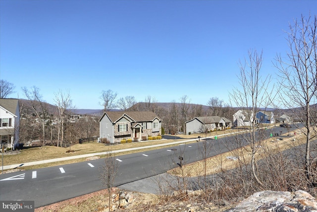 view of street with a residential view and sidewalks