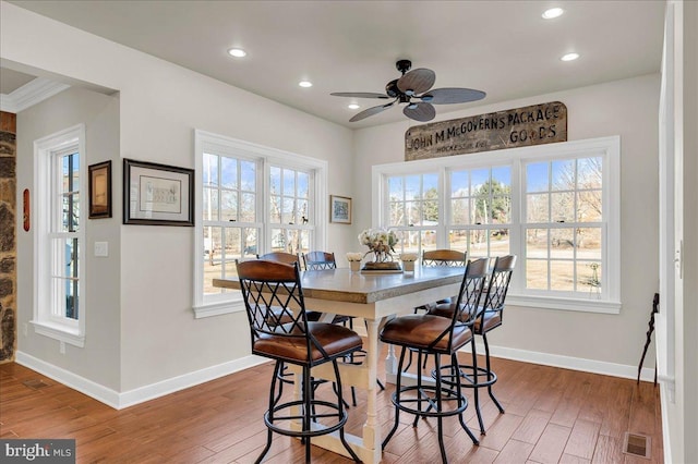 dining room with recessed lighting, visible vents, baseboards, and wood finished floors