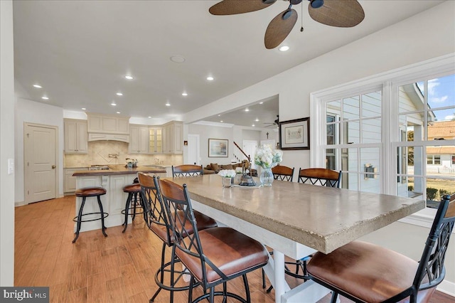 dining space featuring recessed lighting, light wood-type flooring, and ceiling fan