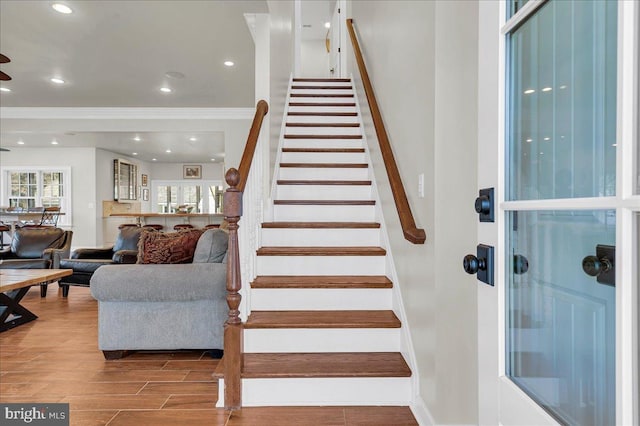 stairs featuring recessed lighting, wood finished floors, and baseboards